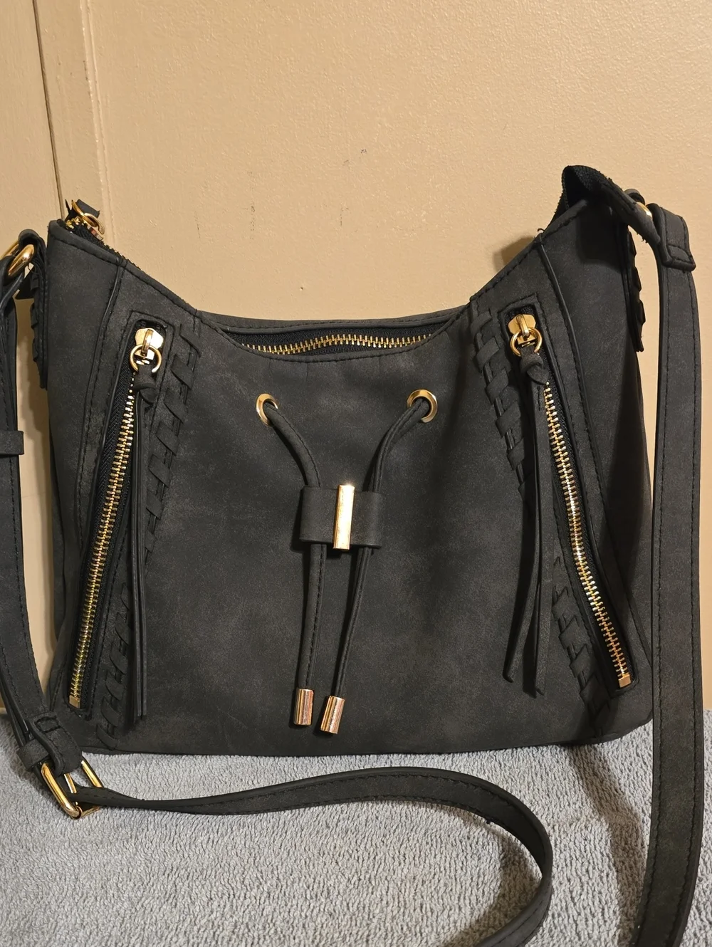 Rosetti Black Suede Drawstring Crossbody Bag with Gold Hardware